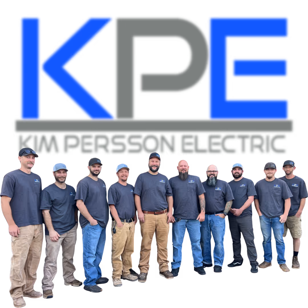 The Kim Persson Electric team in KPE shirts beneath the company logo